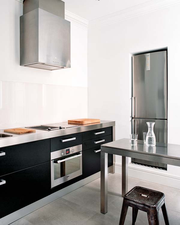 Barcelona-minimalist-classic-kitchen-stainless-steel-farmhouse-stools-black-cabinets.jpg