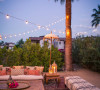 summer Moroccan dinner party inspo Korakia Palm Springs seating string lights via 1000 Layer Cake