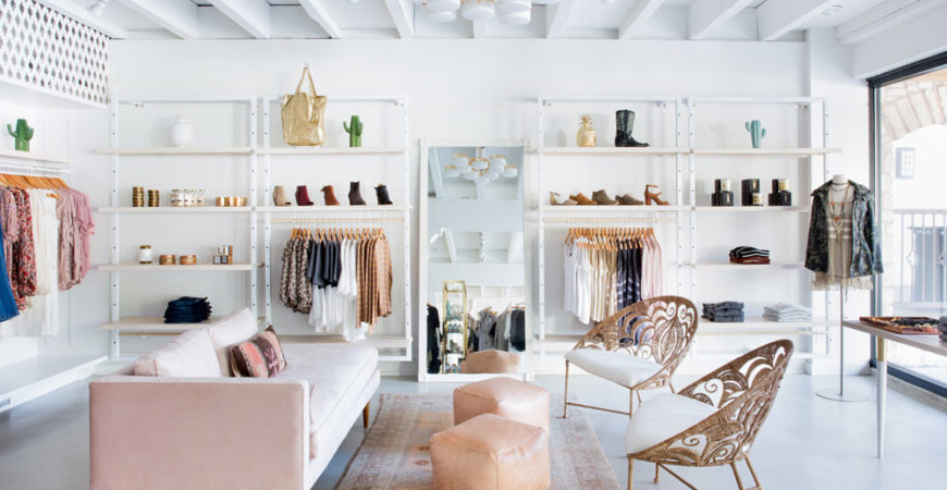 Adelante Boutique by Claire Zinnecker pink couch white gold peach natural peacock bucket chairs