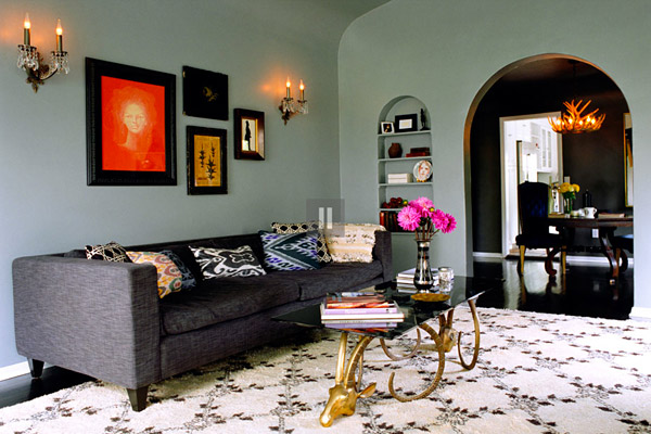 Kishani Perera living room, moroccan rug, ikat pillow, gray couch, rams head table
