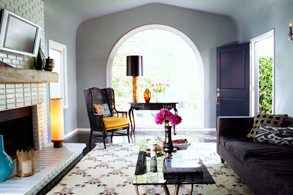 Kishani Perera living room, moroccan rug, white brick fireplace, ikat, black, gold