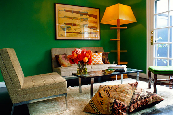 Kishani Perera sitting room, green walls, flokati rug, kilim pillows