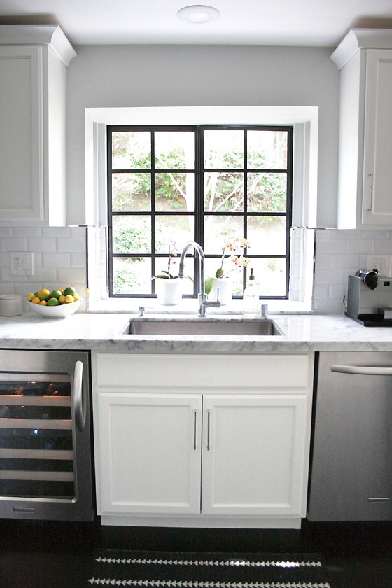small-shop-Erika-Brechtel-white-kitchen-carrera-marble-subway-tile- backsplash-black-frame-window - Erika Brechtel